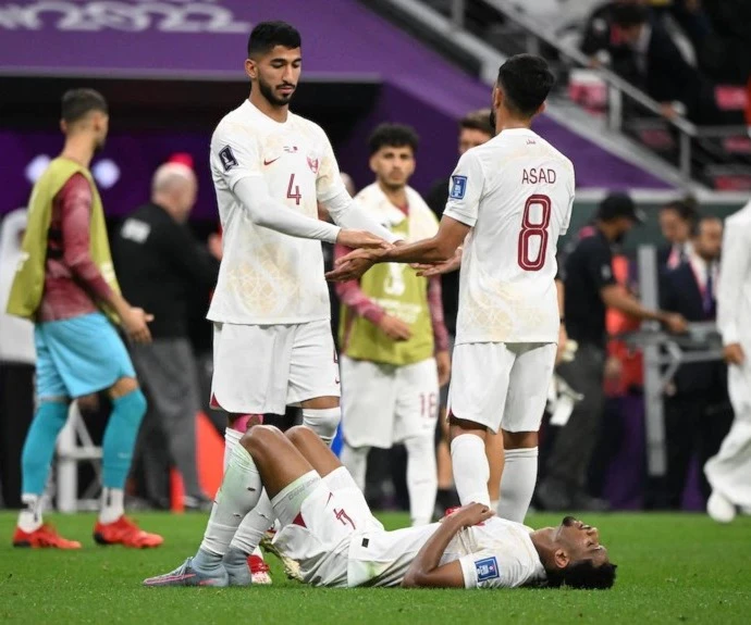 Qatari players slump to the ground and look dejected after their loss to the Netherlands on November 29, 2022 (Reuters) Qatari players slump to the ground and look dejected after their loss to the Netherlands on November 29, 2022 (Reuters)