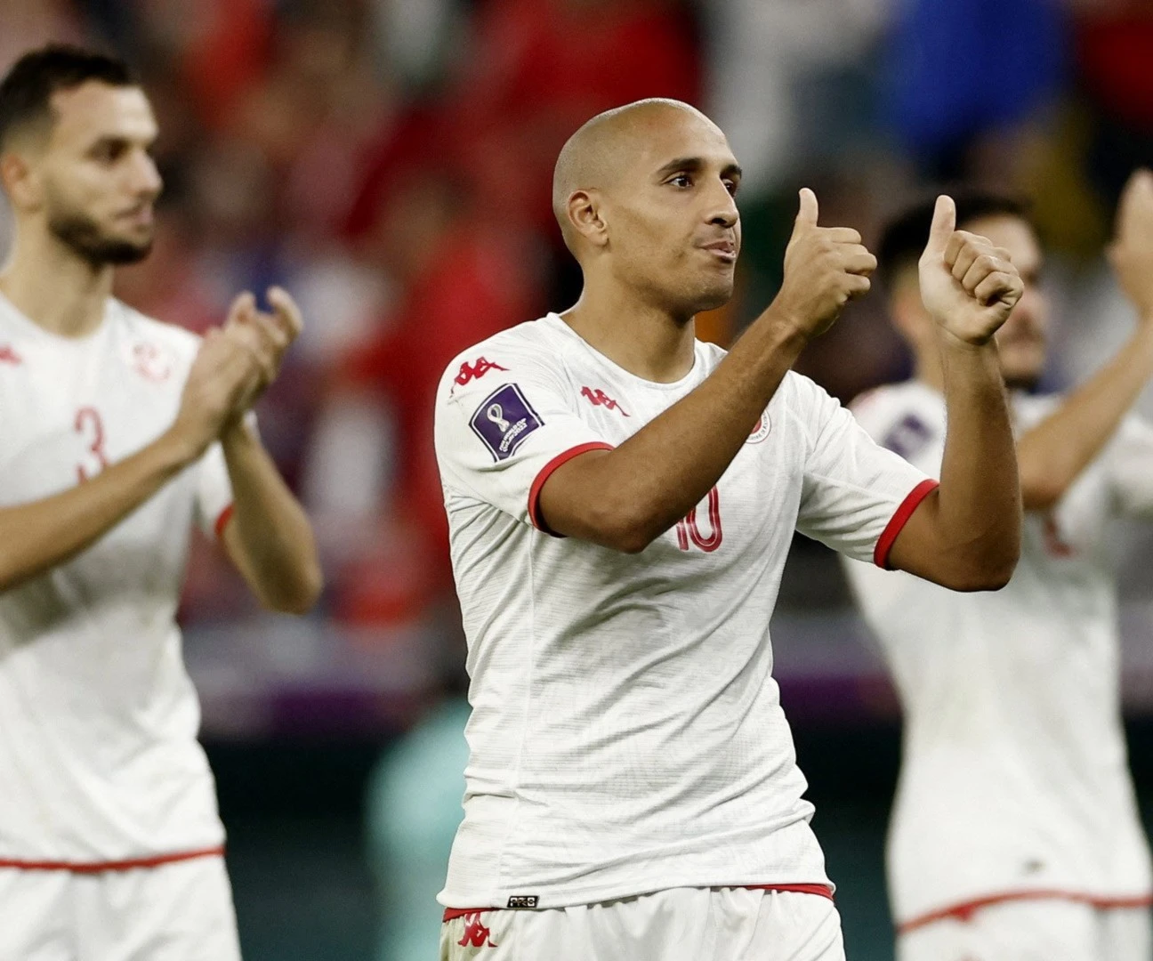 Tunisia's Wahbi Khazri and teammates salute their fans after the match, Qatar, November 30, 2022 (Reuters) Tunisia's Wahbi Khazri and teammates salute their fans after the match, Qatar, November 30, 2022 (Reuters)