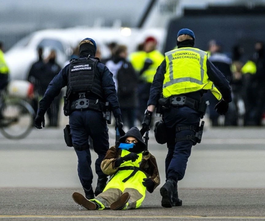 Hundreds of climate protesters staged a huge scale demonstration and blocked a runway at Schiphol airport in the Netherlands on Saturday. Source: Remko De Waal/ANP/AFP/Getty Images. Hundreds of climate protesters staged a huge scale demonstration and blocked a runway at Schiphol airport in the Netherlands on Saturday. Source: Remko De Waal/ANP/AFP/Getty Images.