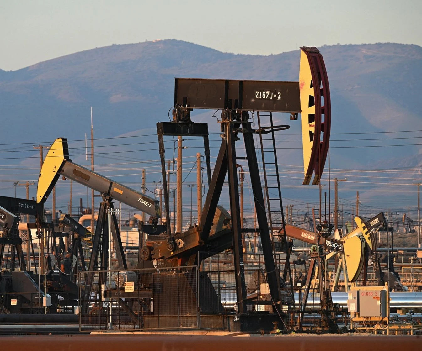Pump jacks drilling for oil Pump jacks drilling for oil