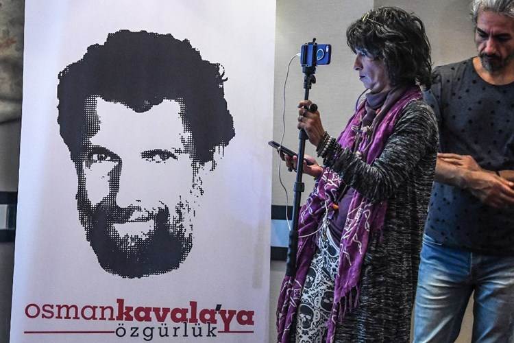 A poster showing the image of businessman Osman Kavala during a press conference held by his lawyers in Istanbul October 31, 2018 (AFP).