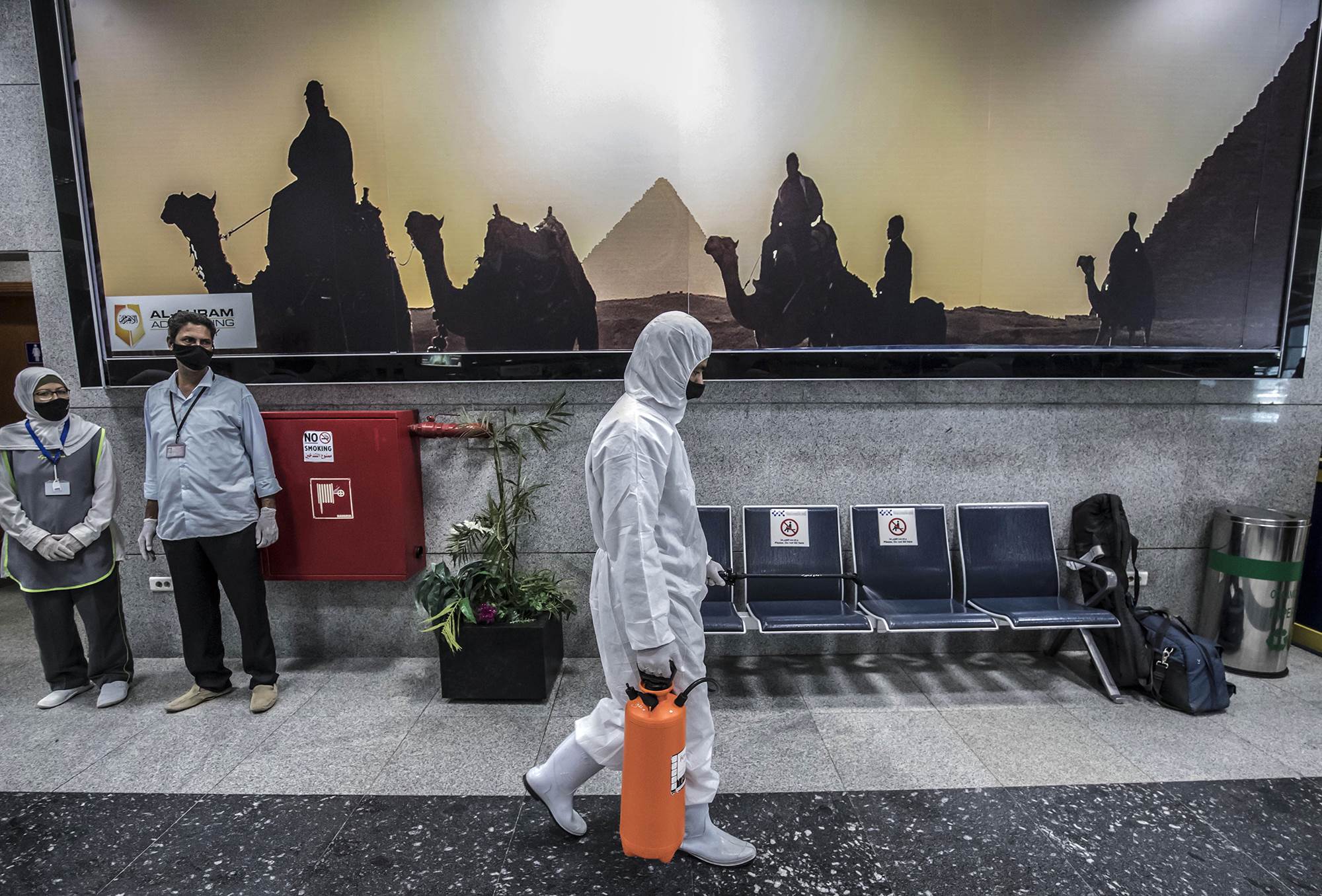A man disinfects the airport’s closed-down resort in Hurghada, June 18, 2020 (Credit: AFP)