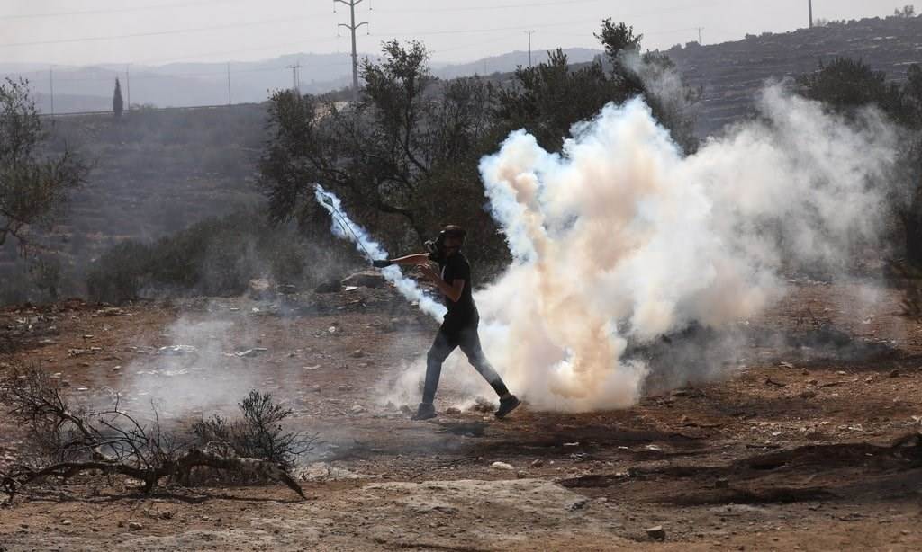 Palestinian youth confront occupation forces in Beita south of Nablus yesterday