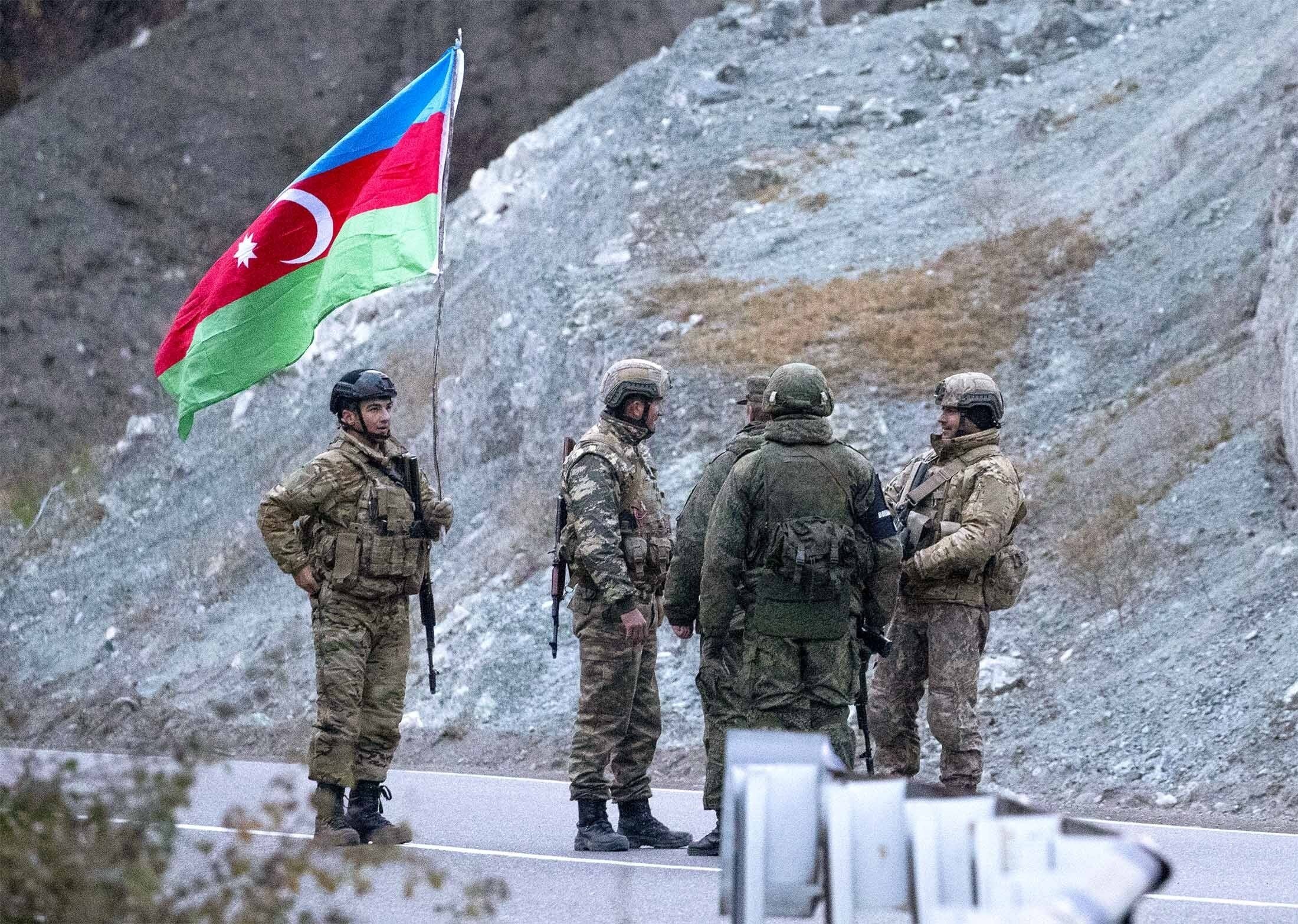 Russian peacekeepers and Azerbaijani servicemen near the village of Dadivank, Kalbajar district, Azerbaijan on November 25, 2020 (Credit: Getty Images)