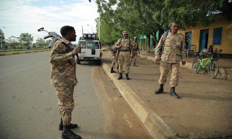 Members of Amhara Special Forces stand guard along a street in Humera town, Ethiopia July 1, 2021 (Reuters)