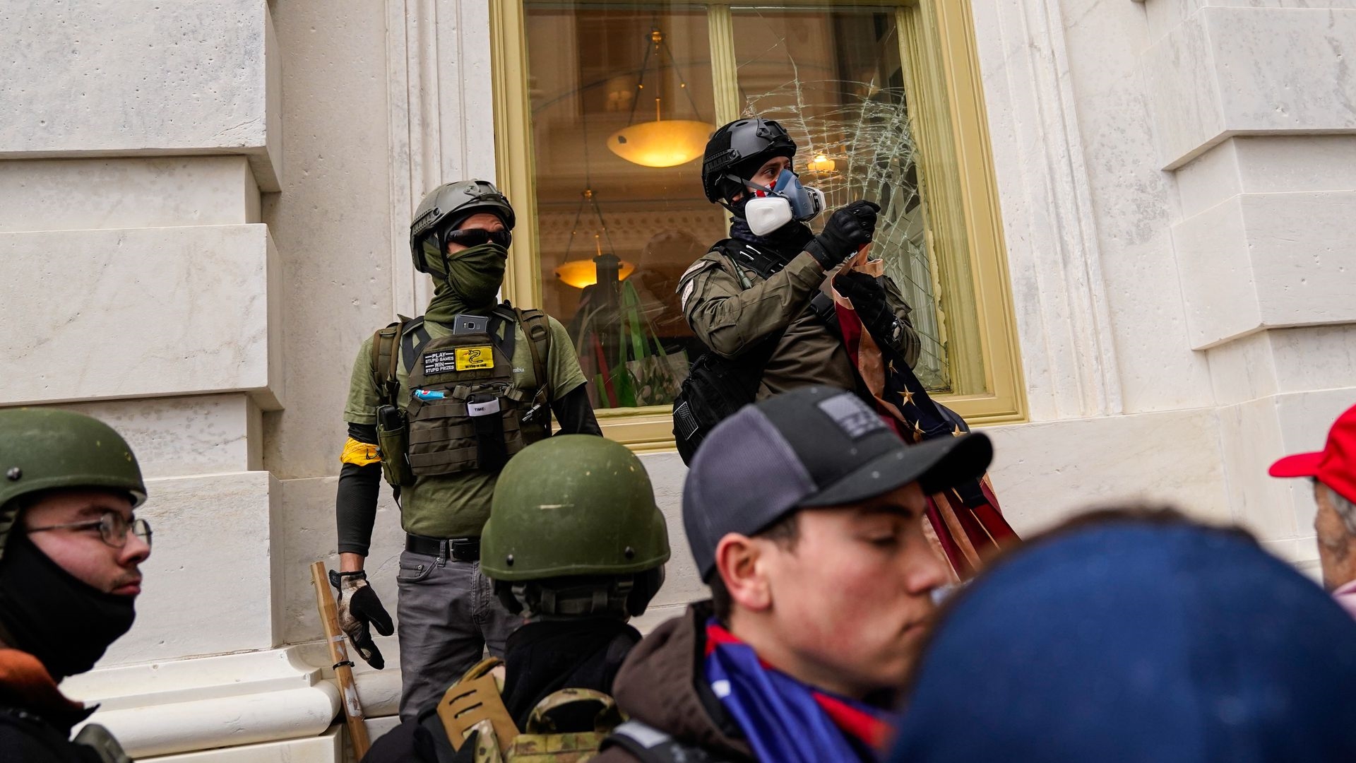 Men wearing tactical gear during the capitol riot on January 6