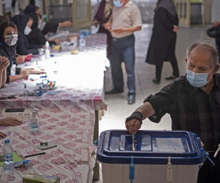 A citizen casts his vote in the Iranian presidential elections (AFP) A citizen casts his vote in the Iranian presidential elections (AFP)