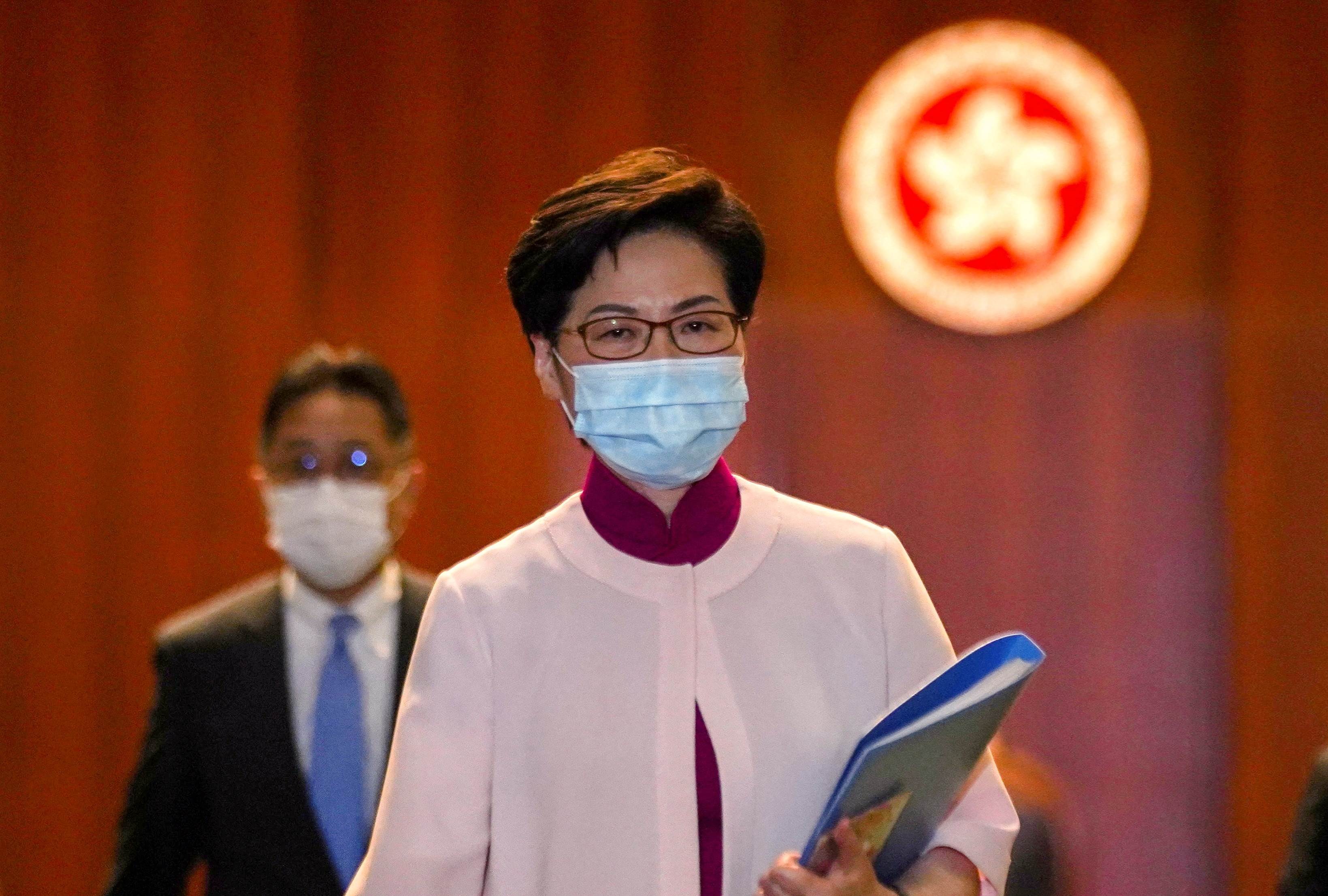 Hong Kong Chief Executive Carrie Lam reacts as she leaves the chamber after delivering her final annual policy address at the Legislative Council in Hong Kong, China, October 6, 2021 (Reuters)