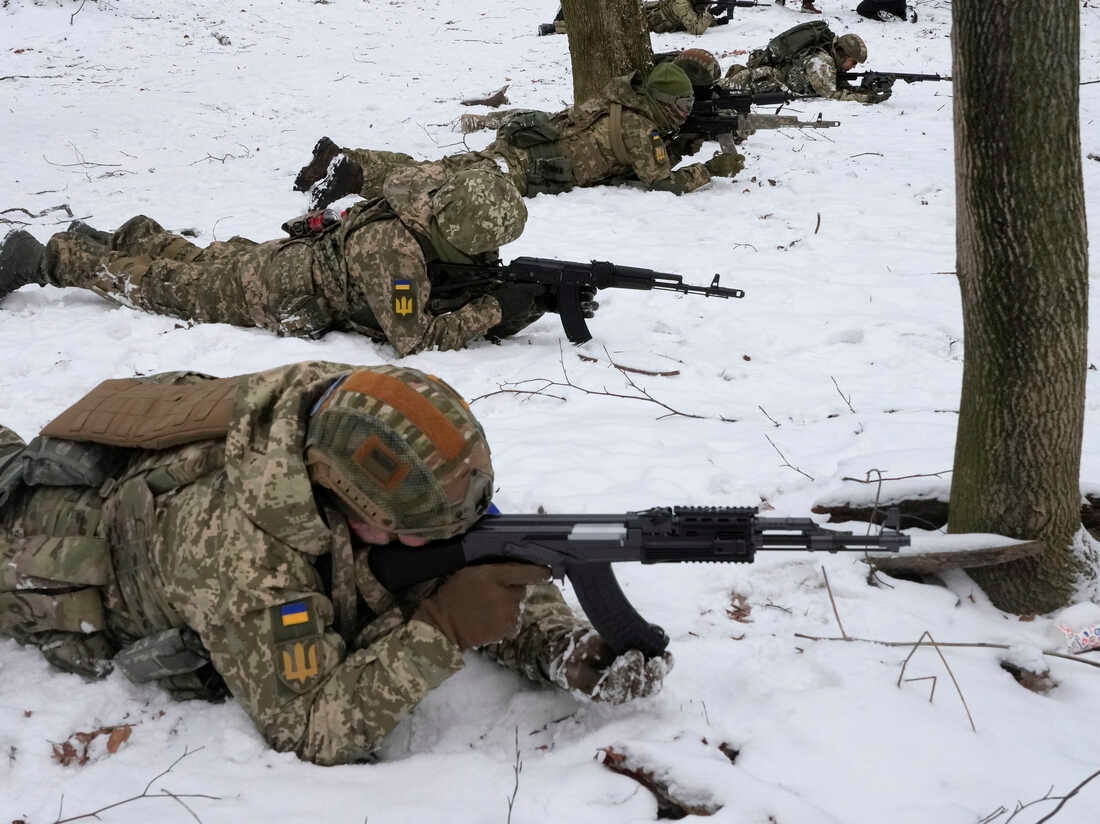 Members of Ukraine's Territorial Defense Forces, volunteer military units of the armed forces, train in a city park in Kyiv