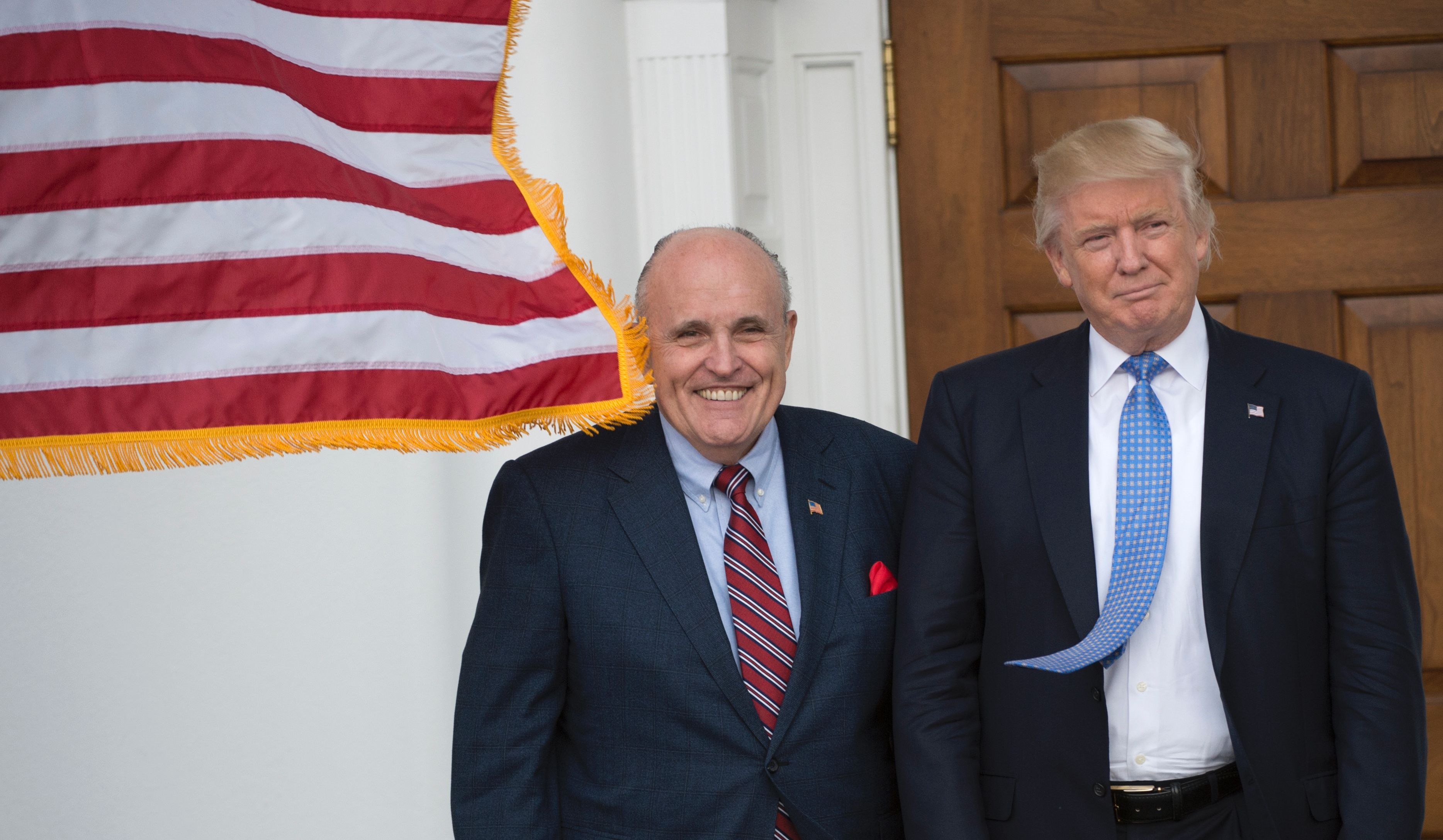 Then-President-elect Donald Trump meets with former New York City Mayor Rudy Giuliani at the clubhouse of Trump National Golf Club November 20, 2016, in Bedminster, New Jersey (AP)