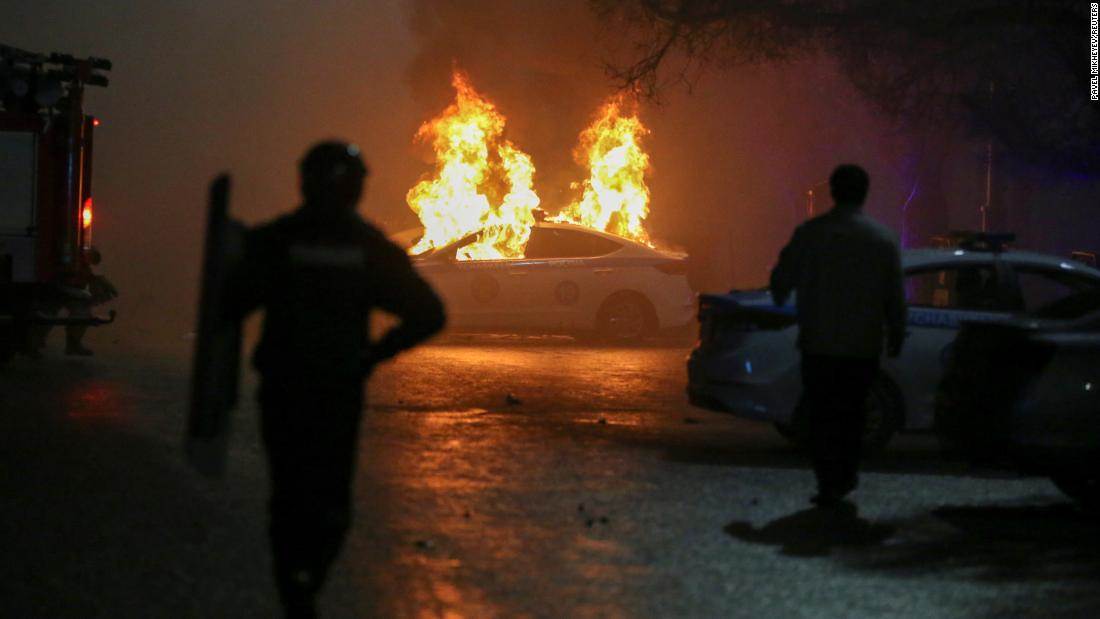 (A police car on fire during a protest in Almaty on Wednesday (Reuters