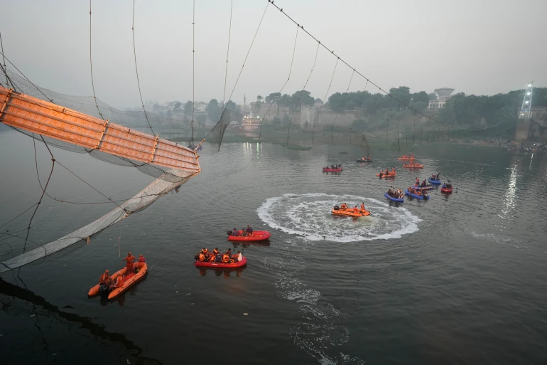 Rescue efforts at the Gujarat Bridge (AFP)