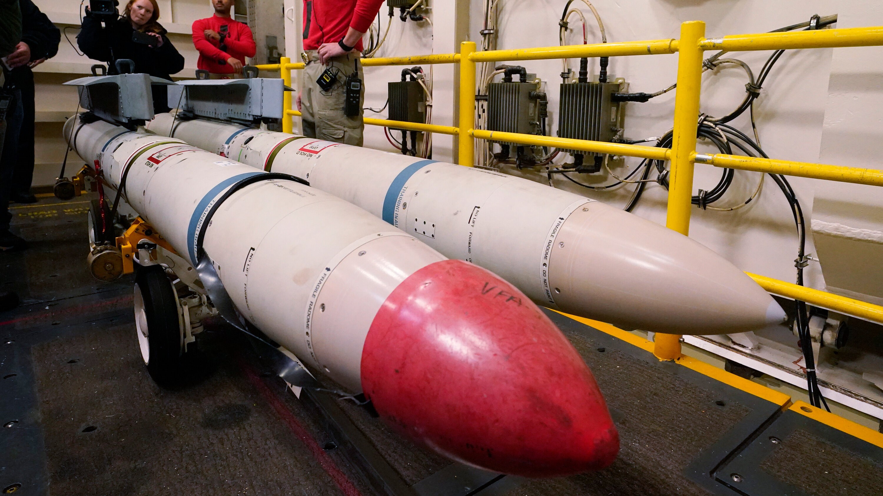 Chief Warrant Officer Jeffrey Towry, standing by AGM-88 air to surface missiles aboard the aircraft carrier U.S.S. Gerald R. Ford, off the coast of Virginia in October. Source: Steve Helber/Associated Press