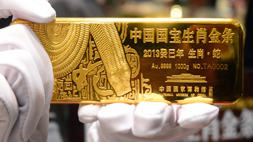 China reveals its gold reserves numbers as it attempts to reduce the proportion of USD it has (AFP)