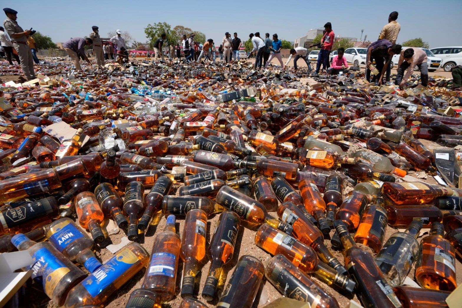 Toxic alcohol bottles gathered in the raid in India (AP)