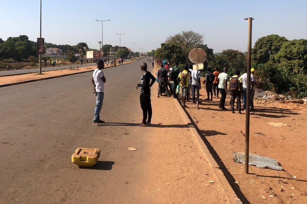 People near the Guinea-Bissau government palace in the capital, Bissau, on Tuesday. (EPA)