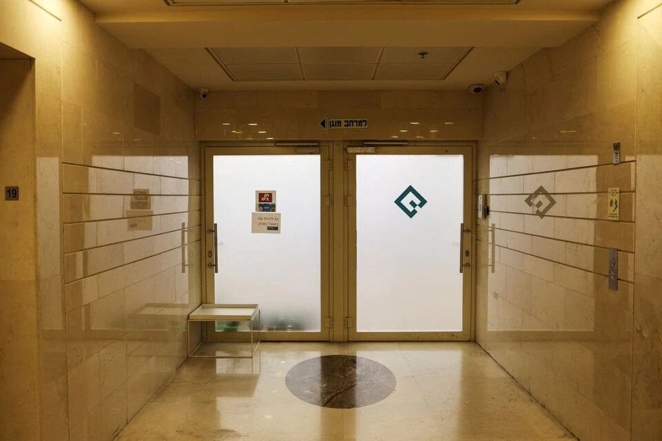 The entrance to an office listed as belonging to Quadream is seen in a high rise building in Ramat Gan, Israel, January 25, 2022. (Reuters)