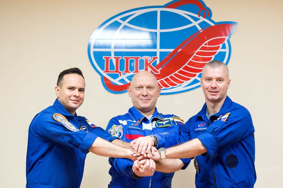 Russian cosmonauts Oleg Artemyev, Denis Matveev and Sergey Korsakov pose for a picture during a news conference ahead of the expedition to the International Space Station (ISS) at the Baikonur Cosmodrome, Kazakhstan March 17, 2022. (Roscosmos)