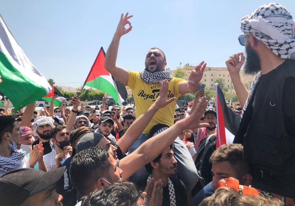 A demonstrator gestures during a protest to express solidarity with the Palestinian people, in Karameh, Jordan valley, Jordan May 14, 2021 (Reuters)