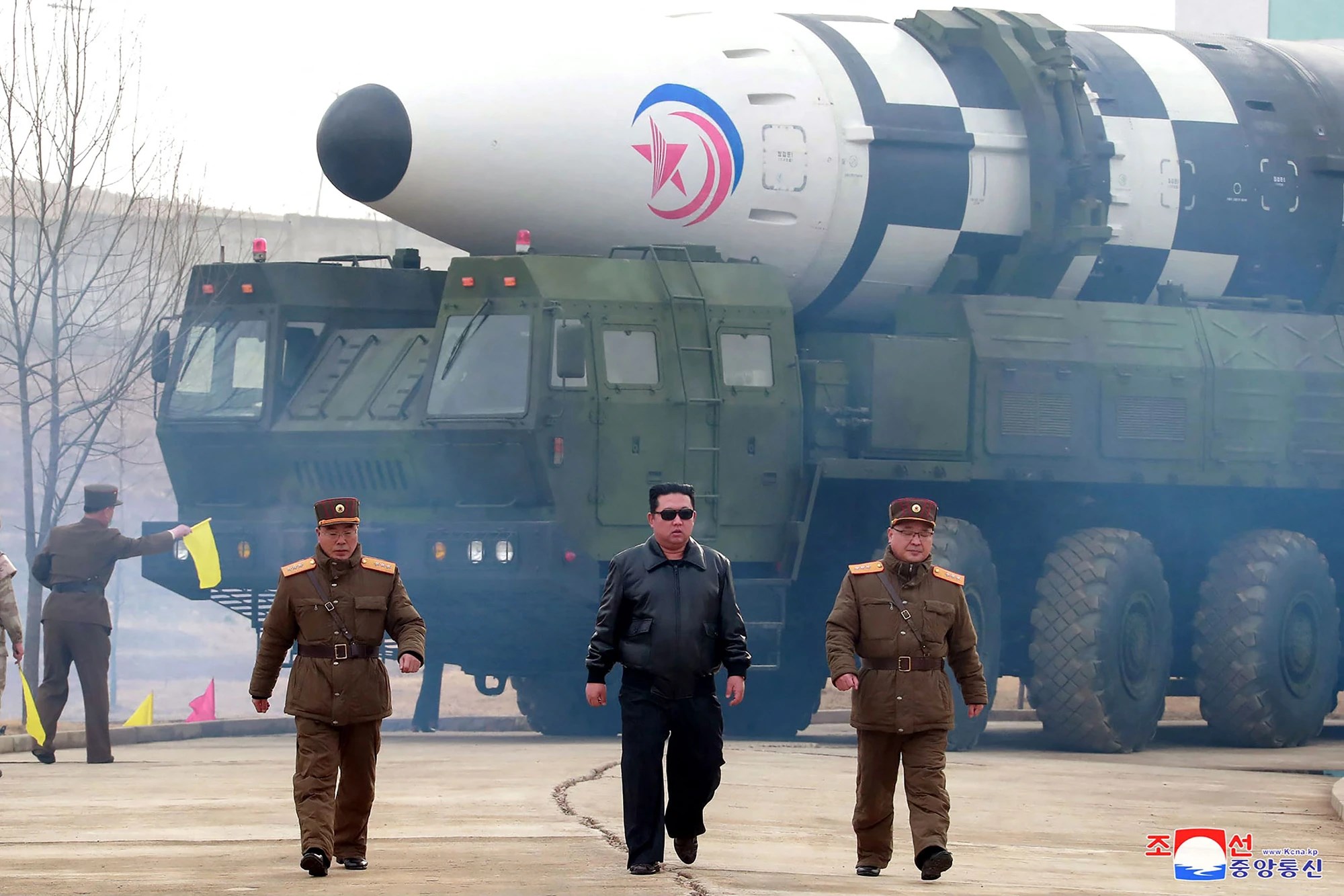 North Korean leader Kim Jong Un walks away from a missile on 24 March 2022 (Reuters)