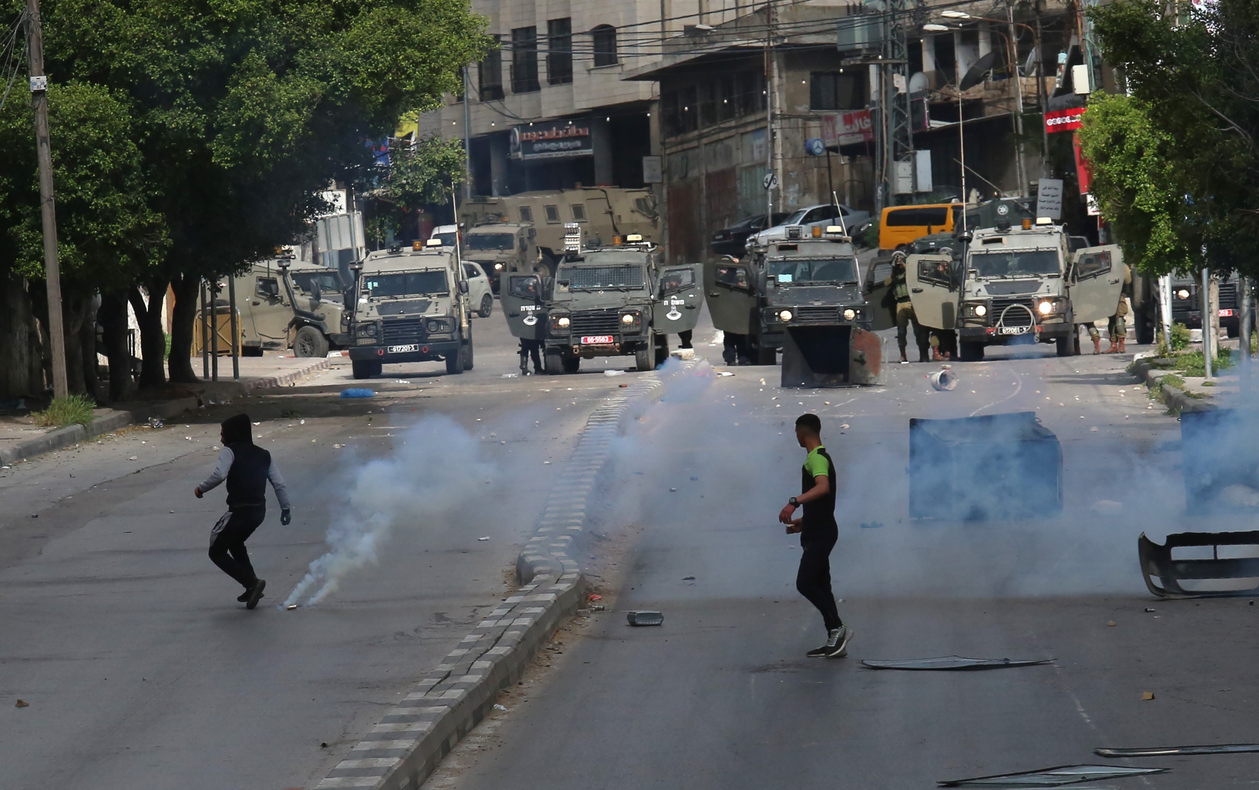 Young Palestinian men confronting the Israeli occupation forces in the occupied West Bank, occupied Palestine April 13, 2022
