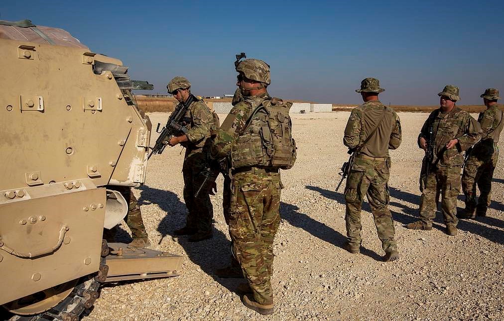 A group of U.S. soldiers board fighting vehicles at a US military base at undisclosed location in Northeastern Syria, Monday, Nov. 11, 2019. (AP)