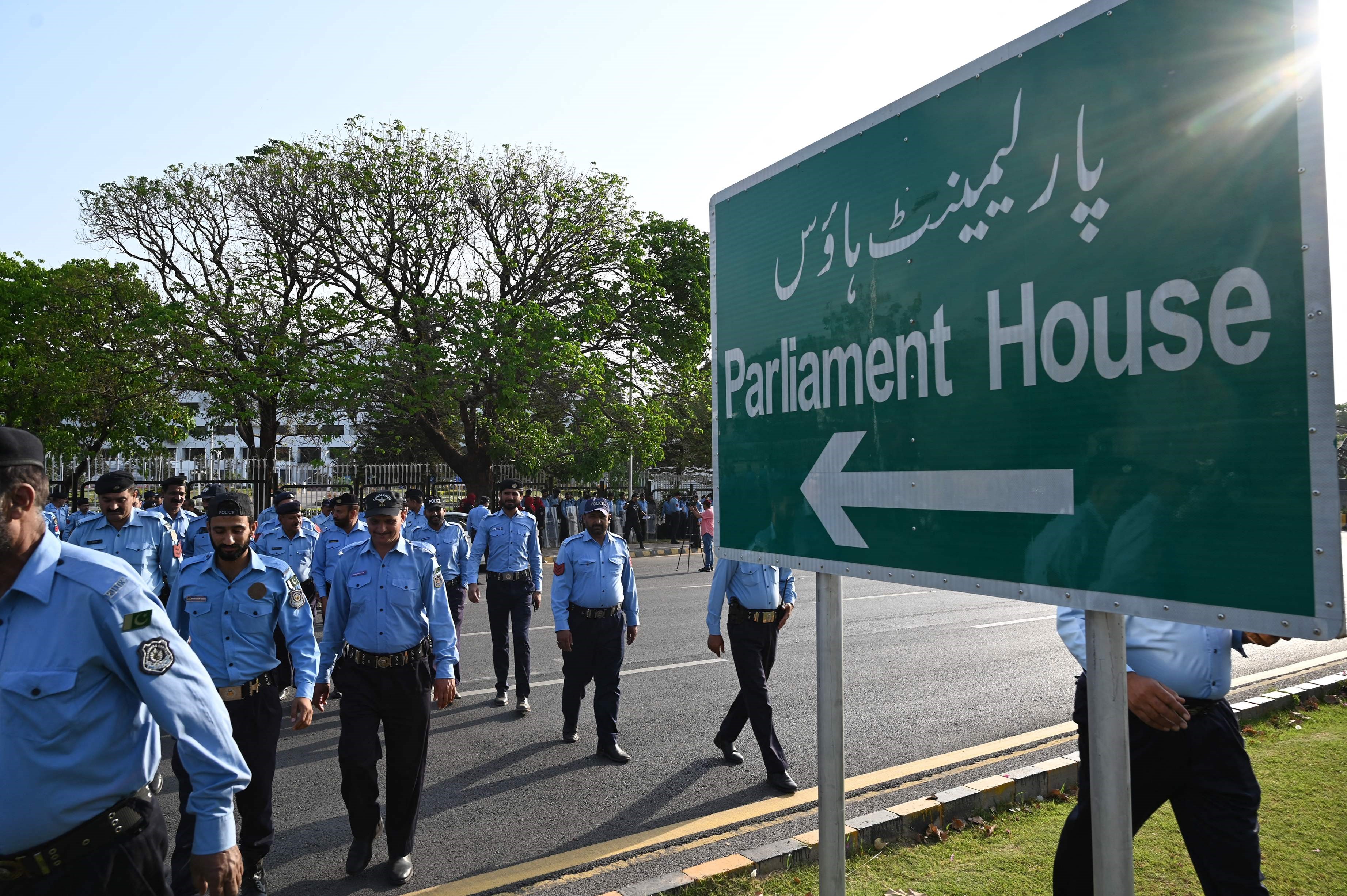 Sign in Islamabad pointing to the direction of the Pakistani National Assembly