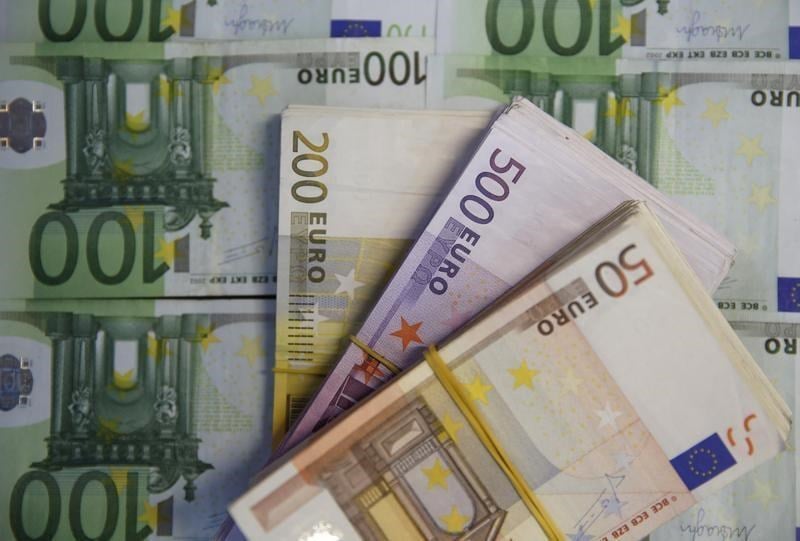 Euro slides below dollar parity for first time in 20 Years.