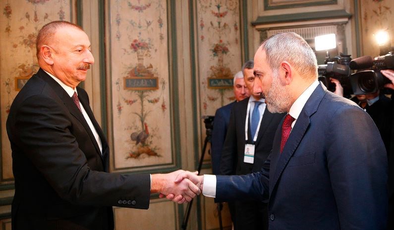 Aliyev and Pashinyan shake hands ahead of talks in Munich on Feb. 15, 2020.