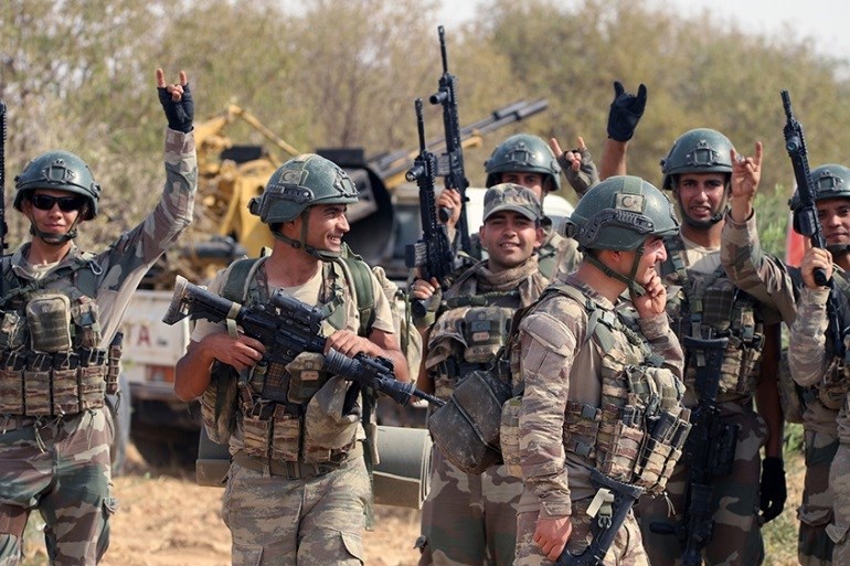 Turkish troops in Syria''s northern region of Manbij on October 14, 2019 (AP)