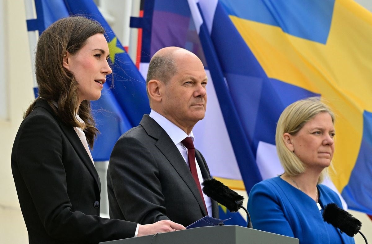 Olaf Scholz, center, with Finnish PM Sanna Marin, left, and Swedish PM Magdalena Andersson in Meseberg, Germany, on May 3, 2022 (AFP)