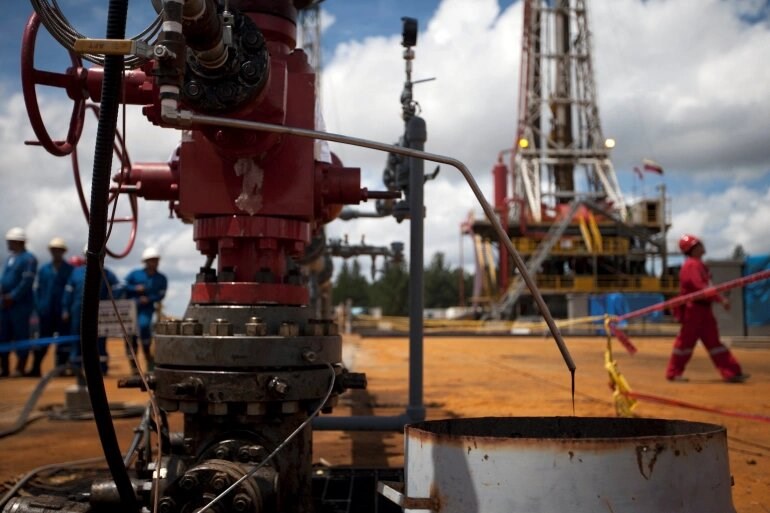  Crude oil drips from a valve at an oil well operated by Venezuela's state oil company PDVSA in Morichal July 28, 2011. (Reuters)