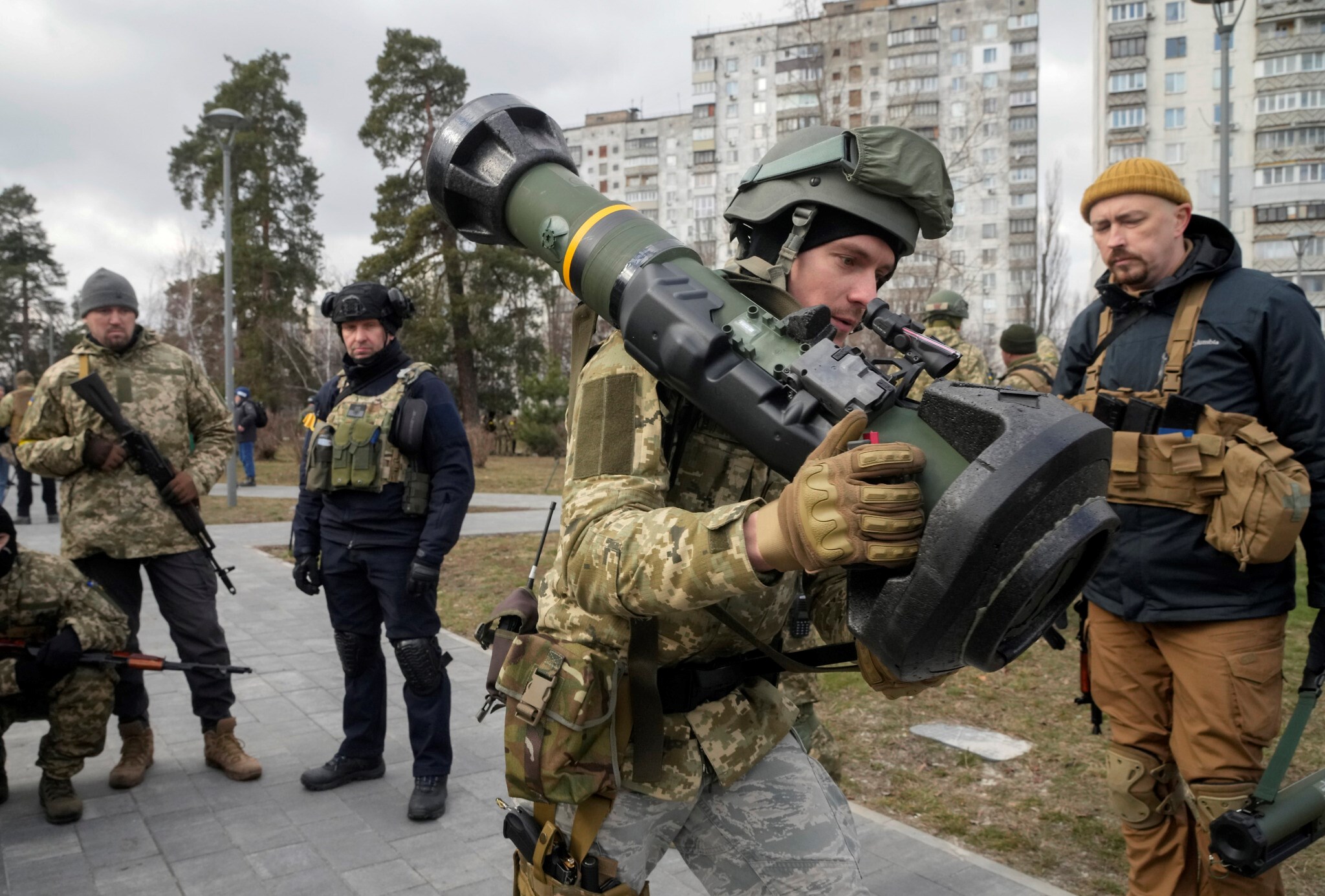 A Ukrainian soldier holds an NLAW anti-tank weapon in the outskirts of Kiev, Ukraine, on March 9, 2022 (AP)
