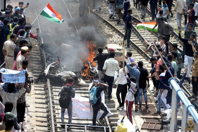 Indian police fire on crowd protesting army recruitment plan.