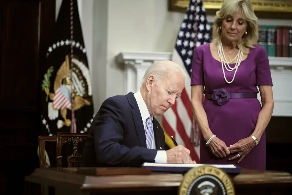 resident Biden signed into law the bipartisan gun bill before leaving for Europe. (The New York Times)