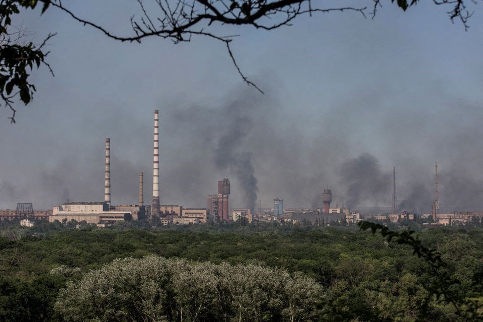 Smoke rises after a military strike on a compound of Severodonetsk's Azot Chemical Plant, Luhansk region, LPR, June 10, 2022 (REUTERS)
