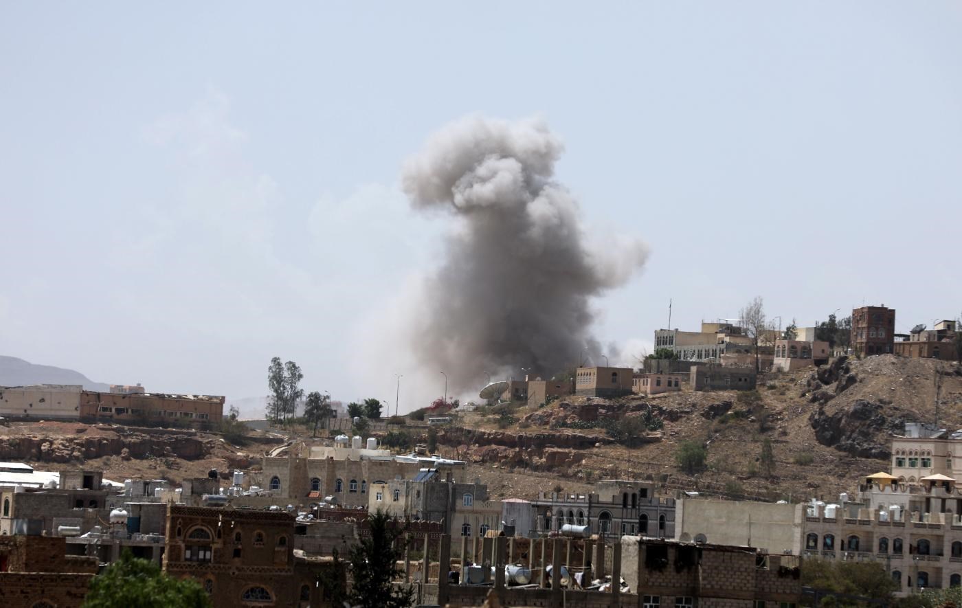 Smokes rise from the site of a Saudi-led coalition air strike in Sanaa, March 30, 2020 (Reuters)