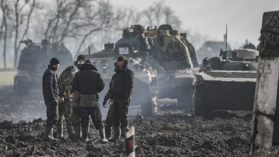 Russian servicemen and armoured vehicles stand on the road in the Rostov region of Russia. (EPA)