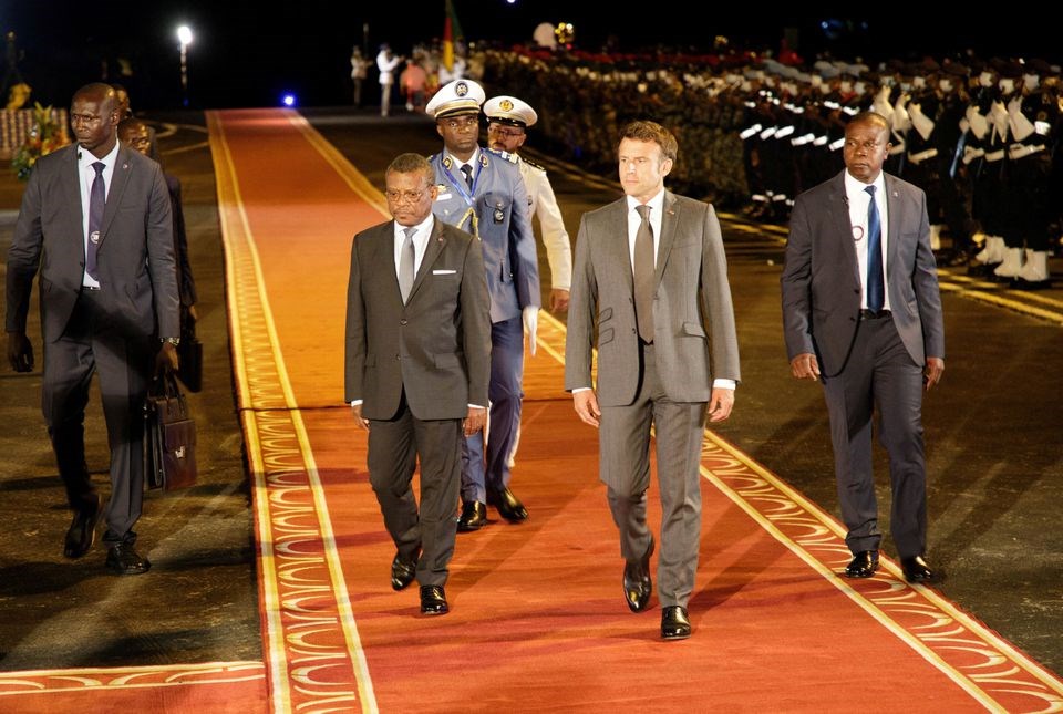 French President Emmanuel Macron with Cameroonian Prime Minister Joseph Dion Ngute on his arrival in Yaounde, Cameroon July 25, 2022 (Reuters)