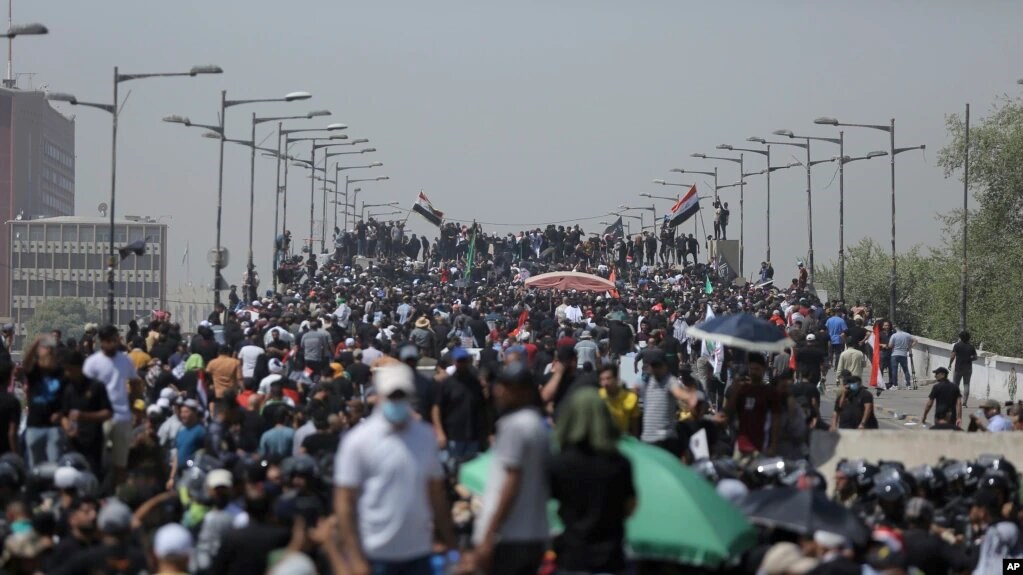 Protesters gather a bridge leading to the Green Zone area in Baghdad, Iraq, Saturday, July 30, 2022. (AP)