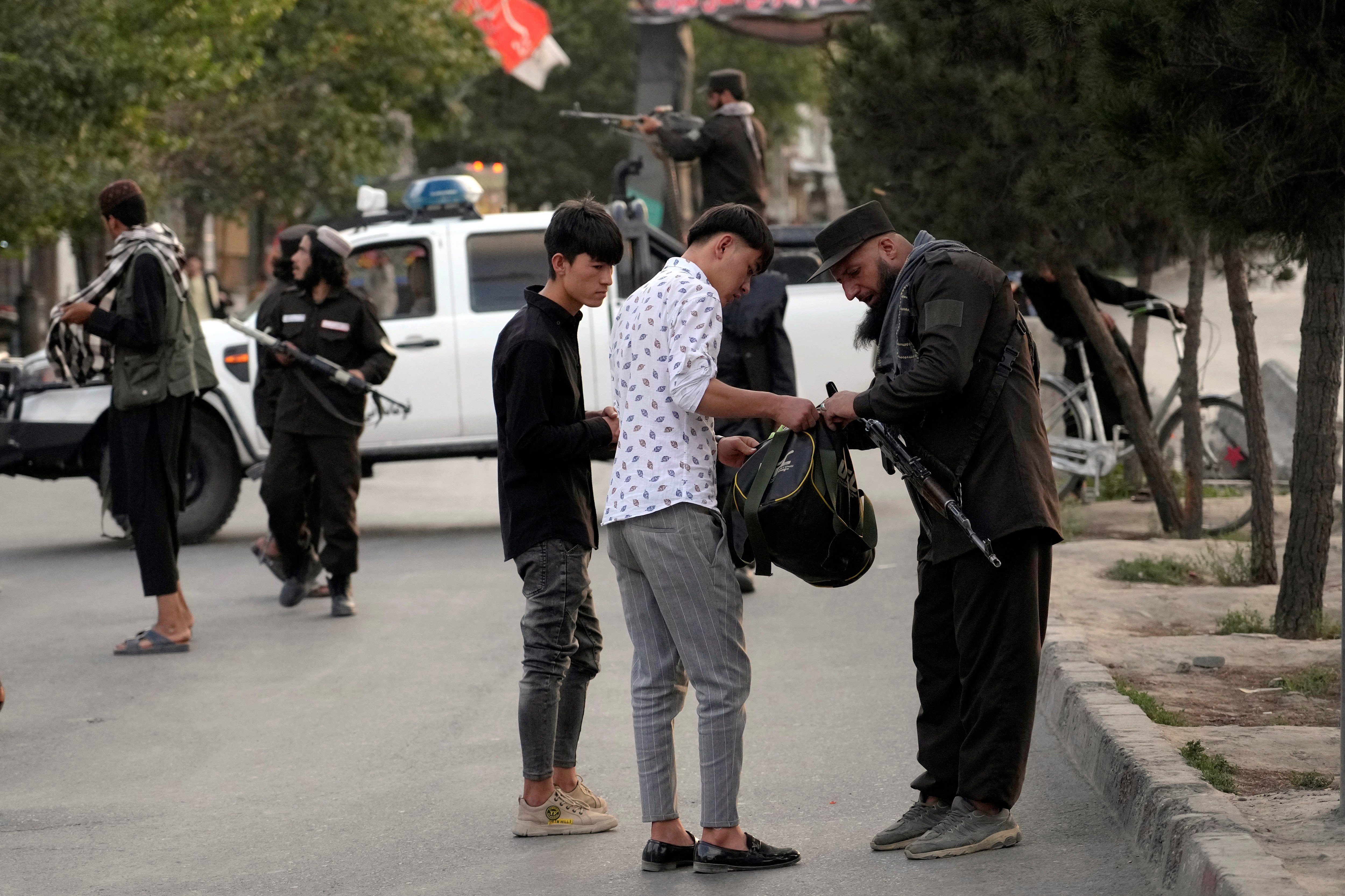 Taliban fighters stand guard at the neighborhood of Dasht-e-Barchi, in Kabul, Afghanistan, Sunday, Aug. 7, 2022 (AP Photo/Ebrahim Noroozi)