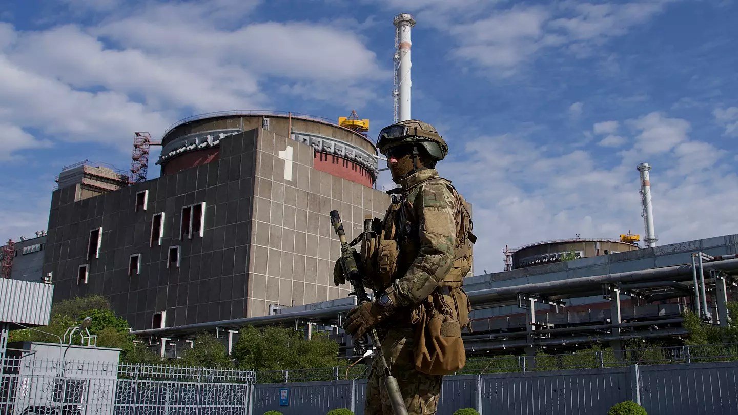 A Russian serviceman patrols the territory of the Zaporizhzhia Nuclear Power Station in Energodar on May 1, 2022