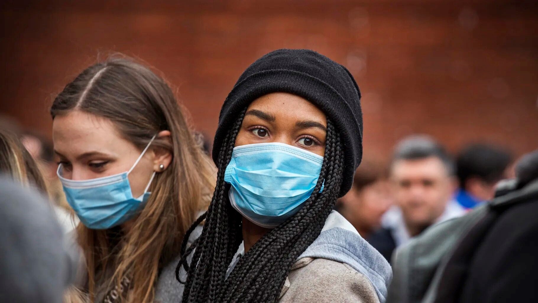 Young women wear face masks as protection against the coronavirus during Chinese New Year celebrations in London on January 26, 2020. (Getty Images)