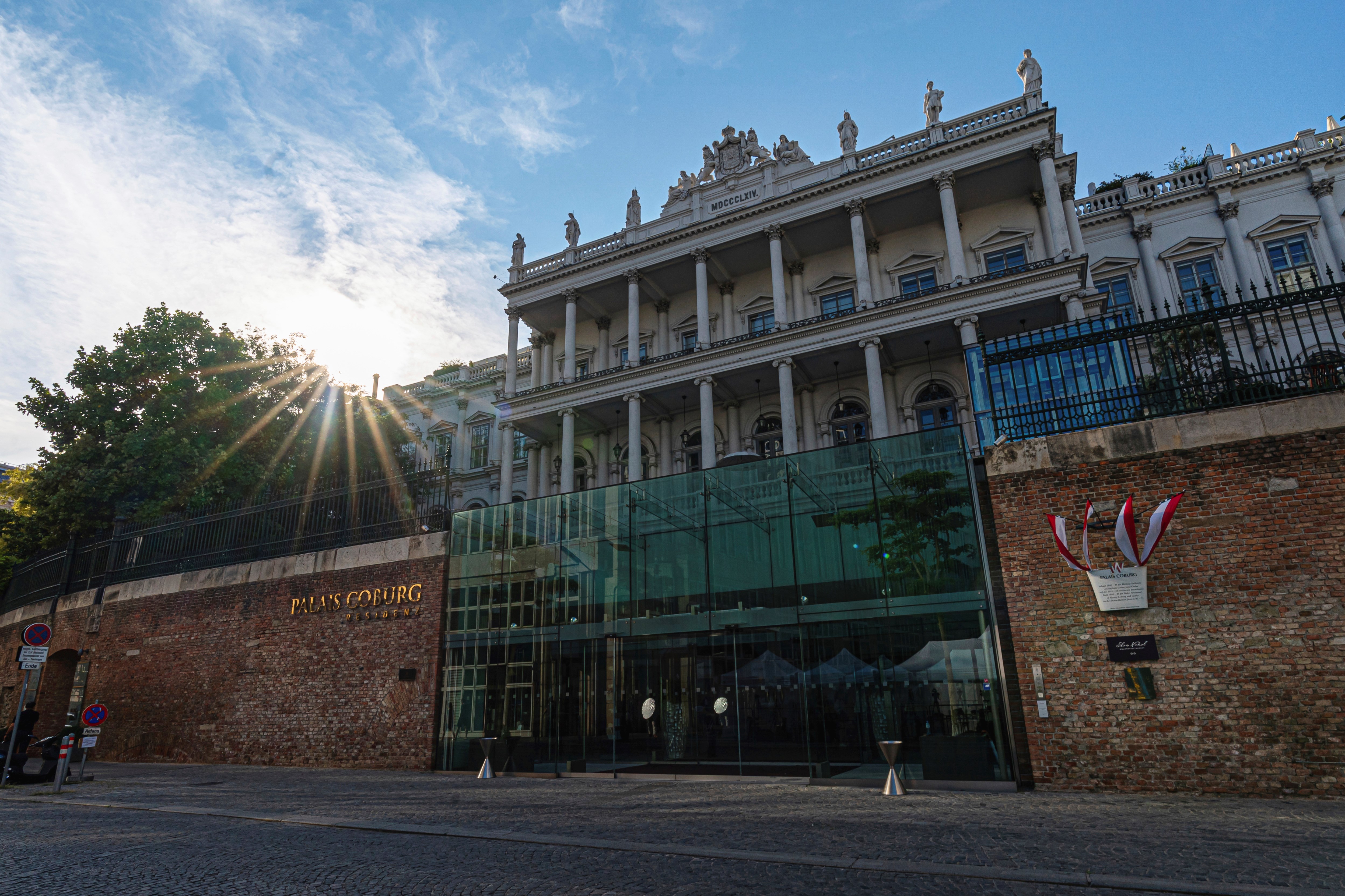 The sun sets behind the Palais Coburg where closed-door nuclear talks take place in Vienna, Austria, August 5, 2022 (AP Photo/Florian Schroetter, File)