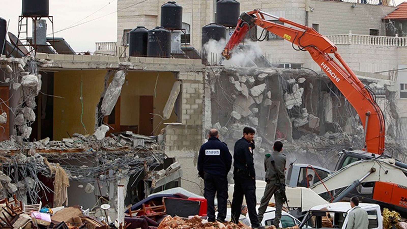 IOF demolishes homes of two Palestinian prisoners in the West Bank