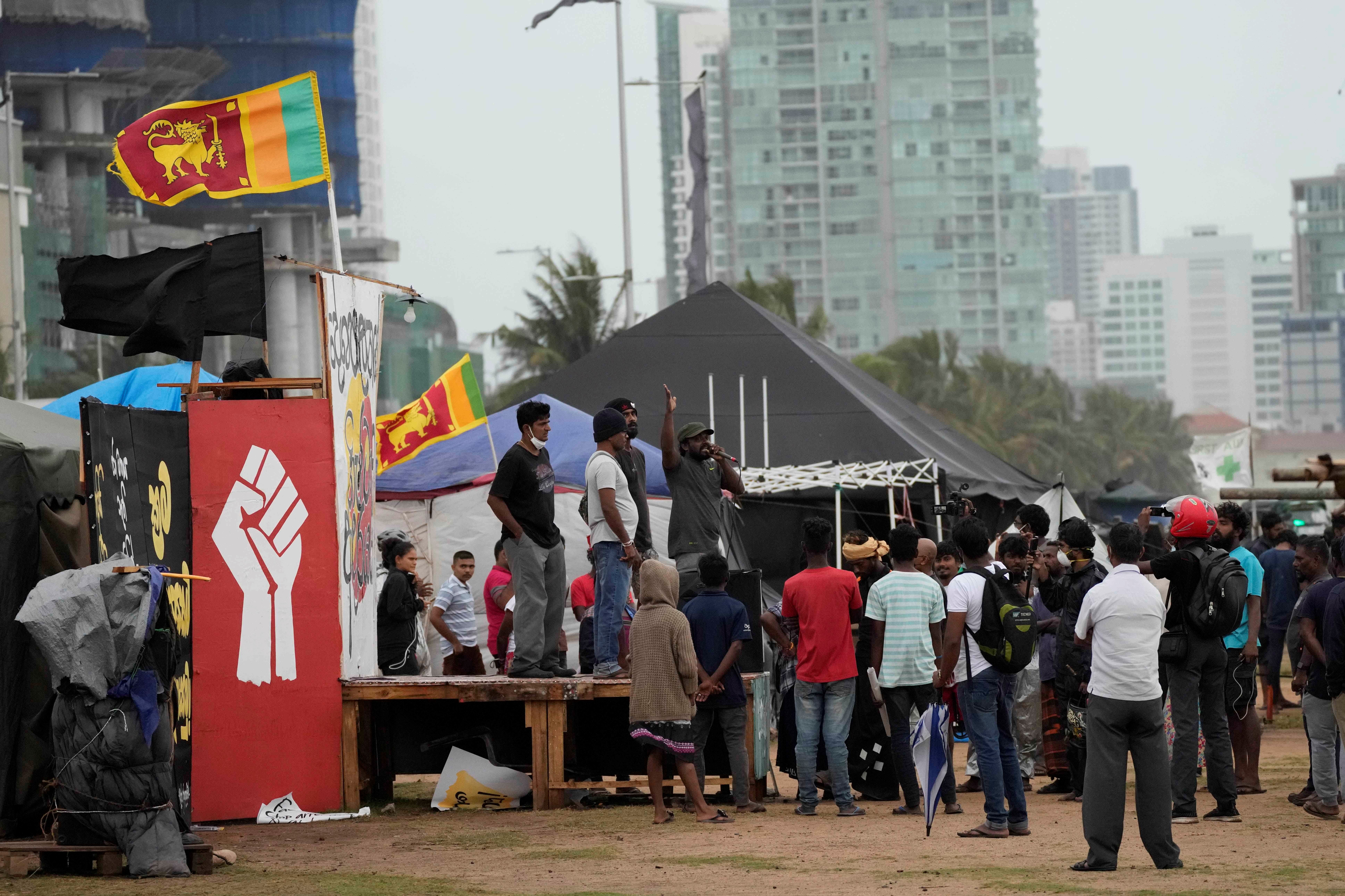 Anti-government protesters shout slogans against electing Ranil w'ickremesinghe as president at the ongoing protest site in Colombo, Sri Lanka, Wednesday, August 3, 2022 (AP Photo/Eranga Jayawardena)