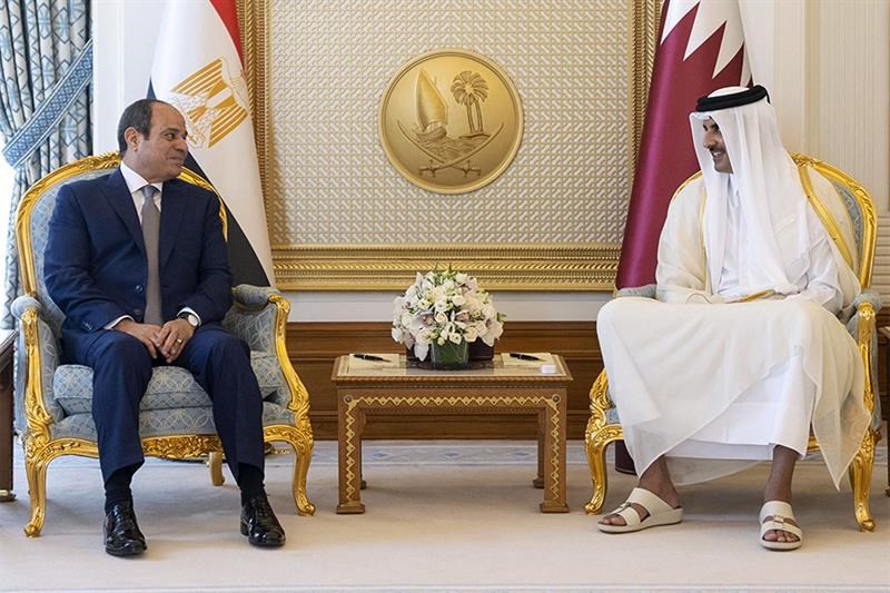 A handout picture released by the Qatar Emiri Diwan on September 14, 2022, shows Qatar s Emir Sheikh Tamim bin Hamad al-Thani (R) and Egypt s President Abdel Fattah al-Sisi (L) meeting at the Royal Palace in Doha. AFP.