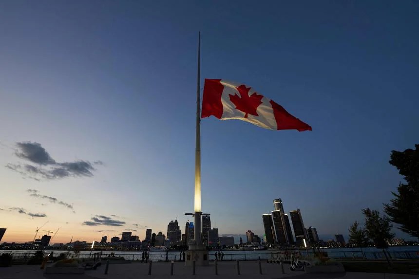 The Canadian flag flies at half mast on the Detroit River in Ontario to honour the late Queen Elizabeth, on Sept 13, 2022. PHOTO: AFP