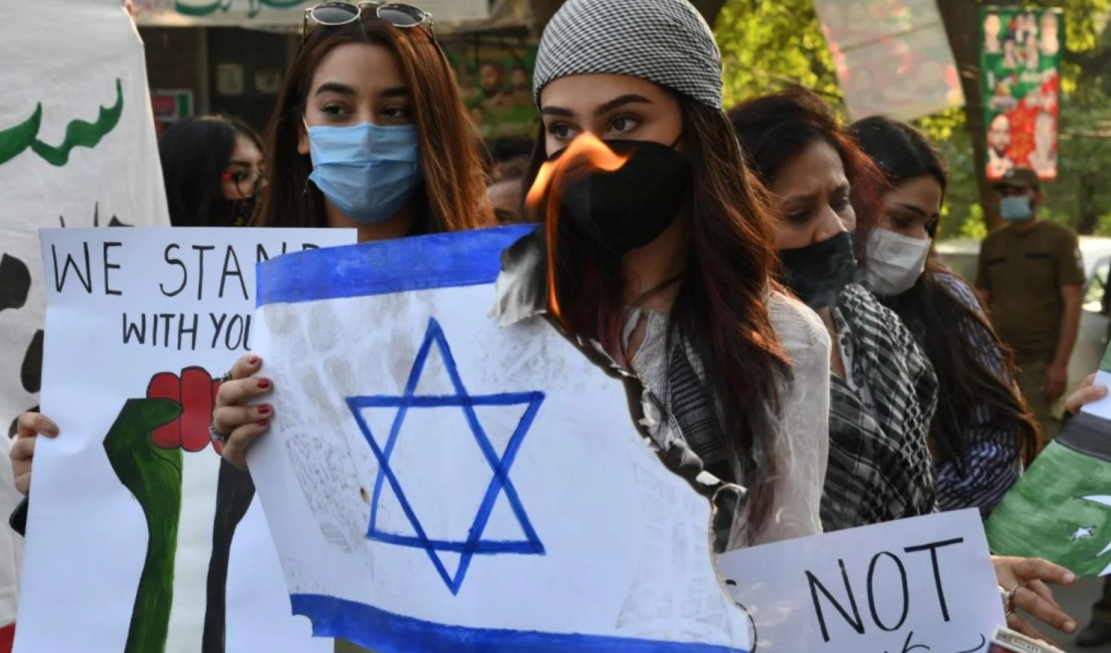 Pakistani protestors in Lahore, Pakistan, condemning Israeli airstrikes on Gaza in 2021 (AFP)