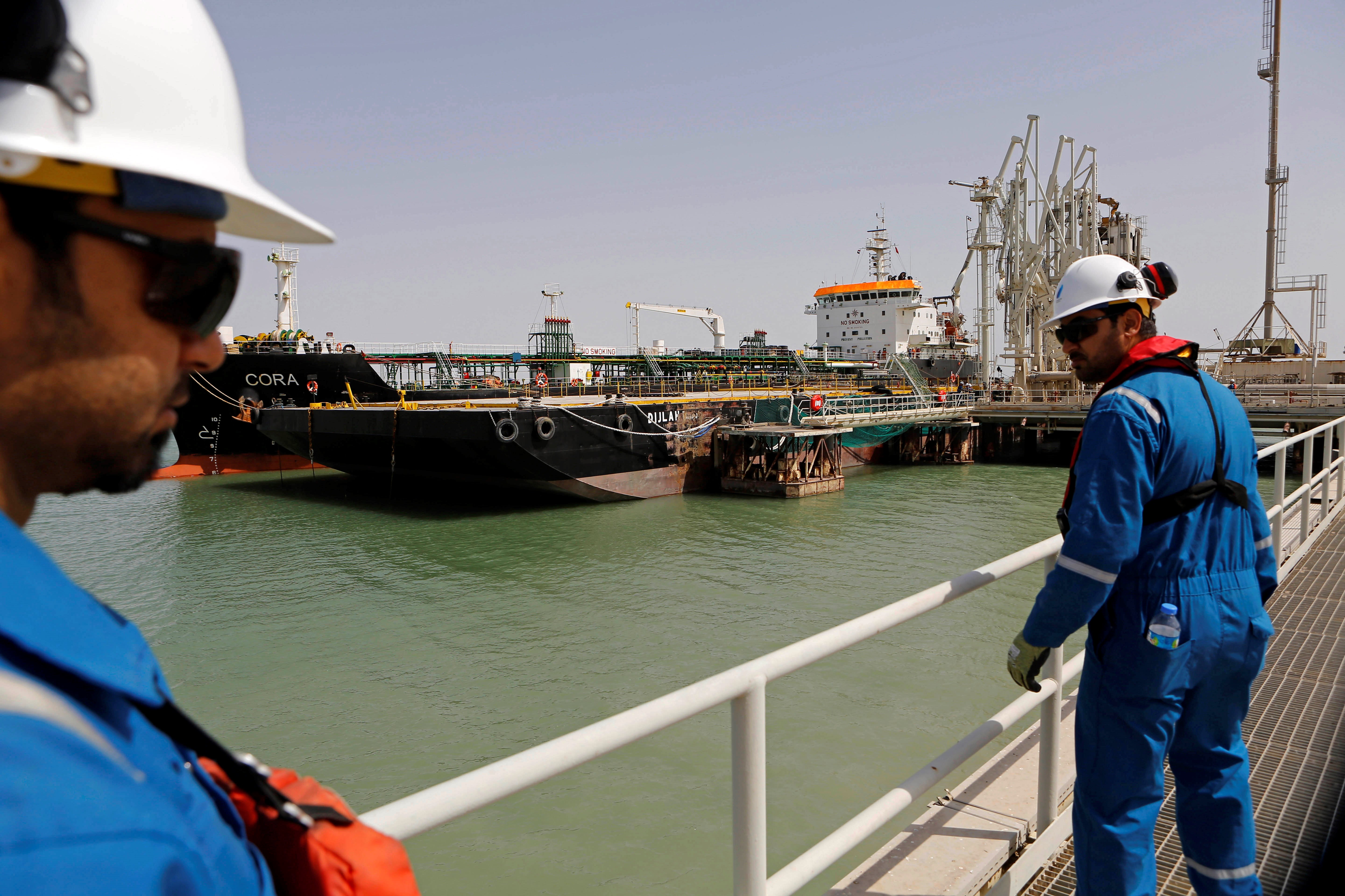 Iraqi engineers observe a gas carrier as it prepares to set sail at the southern port of Umm Qasr near Basra, Iraq, Sunday, March 20, 2016 (AP Photo/Nabil al-Jurani)